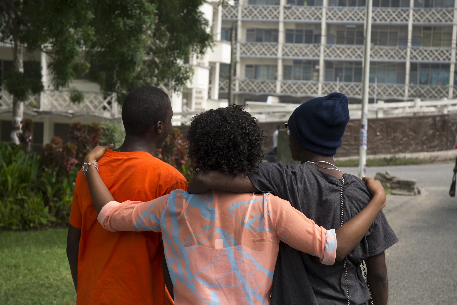 Friends hugging from behind 