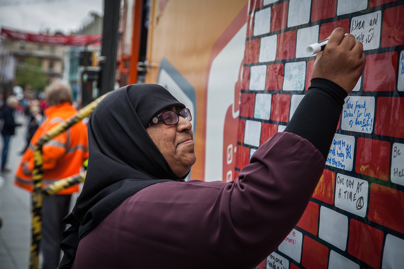Yasmin signing the pledge wall are ruok event